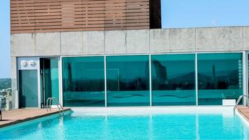 Indoor pool, outdoor pool, open 6:00 AM to 10:00 PM, pool umbrellas