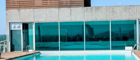 Indoor pool, outdoor pool, open 6:00 AM to 10:00 PM, pool umbrellas