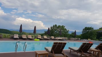 Outdoor pool, open 6:00 AM to 9:00 PM, pool umbrellas, sun loungers