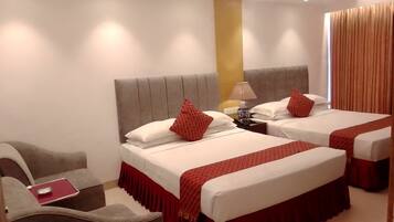 Deluxe Quadruple Room, 2 Bedrooms, Smoking, City View | Pillowtop beds, in-room safe, desk, blackout drapes