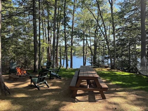 QUINTESSENTIAL MAINE LOG CABIN SET ON GORGEOUS LAKE