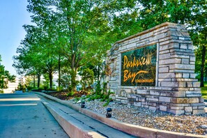 A stone sign with "Parkview Condominiums" written in gold lettering.