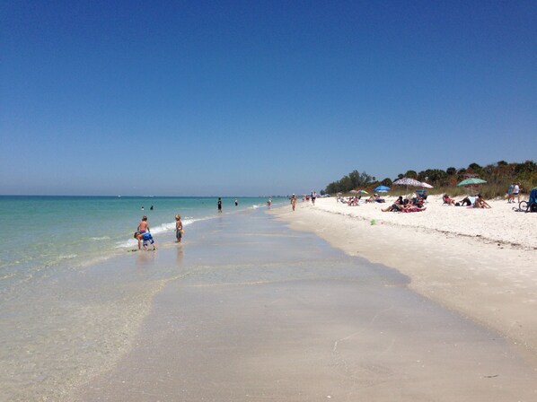On the beach, sun-loungers, beach towels