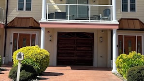 A multi-story residential building with a central entrance, a garage, and a balcony on the upper floor. - BIG HOUSE WITH POOL OCEANVIEW 3 DECKS, 3 MASTER VERY NEAR OCEAN AND BOSRDWALK (Wildwood Crest)