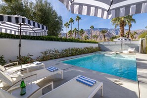 A heated pool, pool loungers