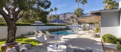 A heated pool, sun loungers