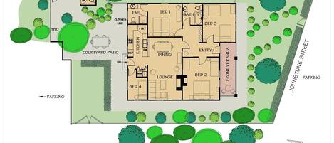 A floor plan of a hotel with four bedrooms, a dining area, a lounge, and a courtyard patio.