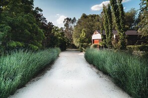 Escape to a serene rural retreat surrounded by lush greenery and gardens.