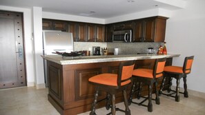 Fridge, microwave, stovetop, coffee/tea maker