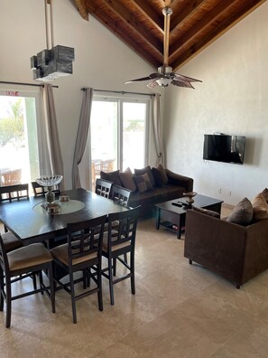 TV, books - Spacious Secluded Waterfront Home with compact car (Bottle Creek)