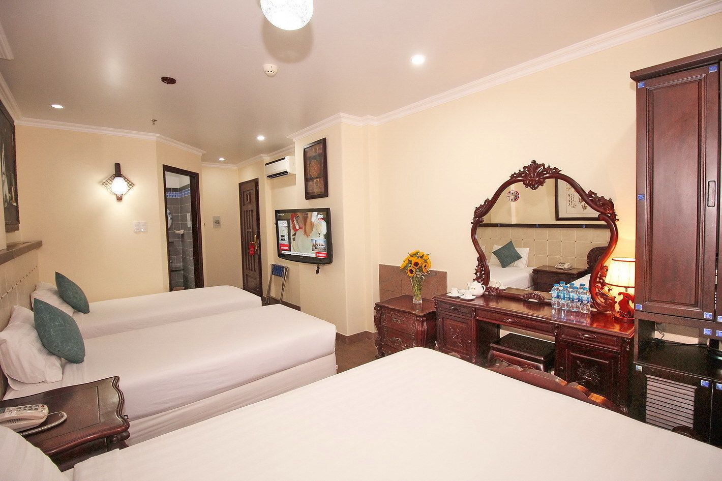 deluxe family room | minibar, desk, blackout curtains, iron/ironing board