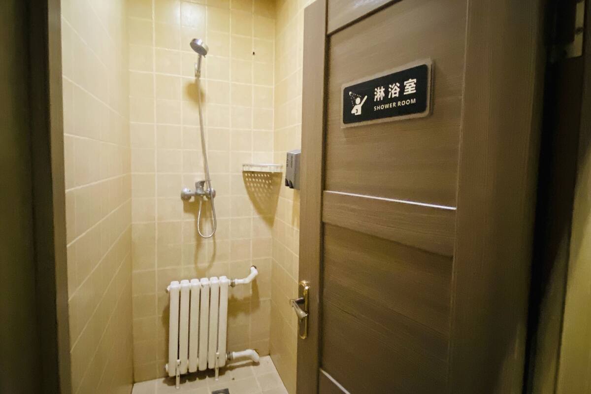 Shower, free toiletries, slippers, towels