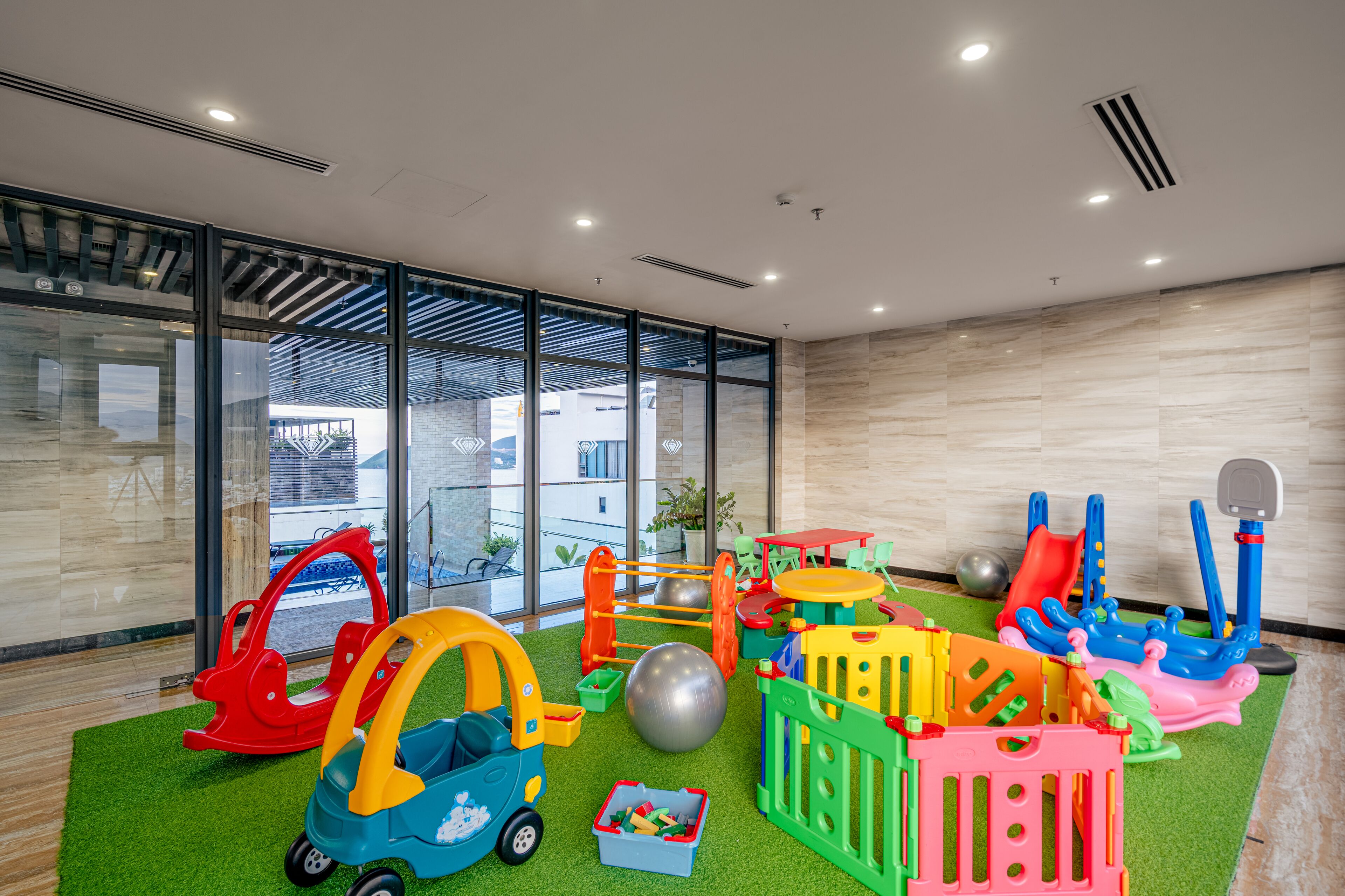 A children's play area with various toys and play structures.