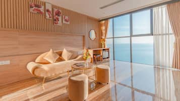 套房, 海洋景观 | 起居区 | 23-英寸纯平电视 (配备有线频道)、电视