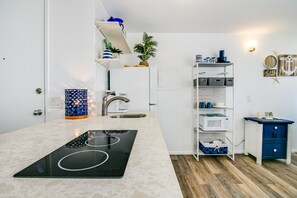 Fridge, microwave, stovetop, coffee/tea maker