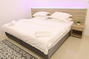 4 bedrooms, premium bedding, in-room safe, individually decorated