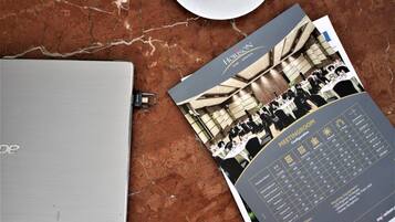 A brochure for Horizon GKB - Gresik, detailing meeting room configurations, dimensions, and amenities like a standard meeting room, LCD projector, and water access.