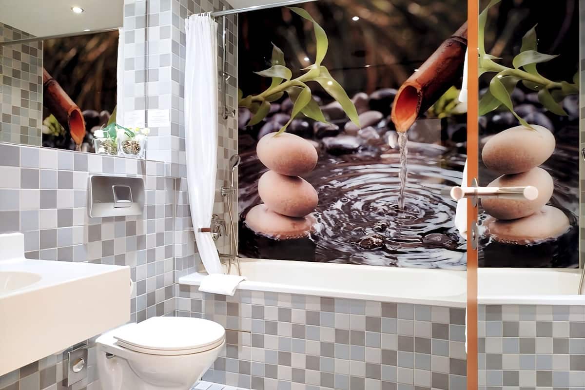 bathtub, free toiletries, hair dryer, towels