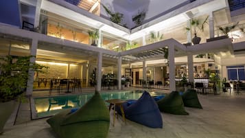 Outdoor pool, open 7:00 AM to 10:00 PM, pool loungers