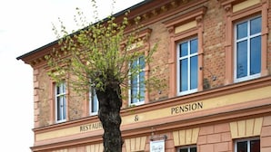 A building with a sign reading "Restaurant & Pension." - Restaurant Esslust (Niedergoersdorf)