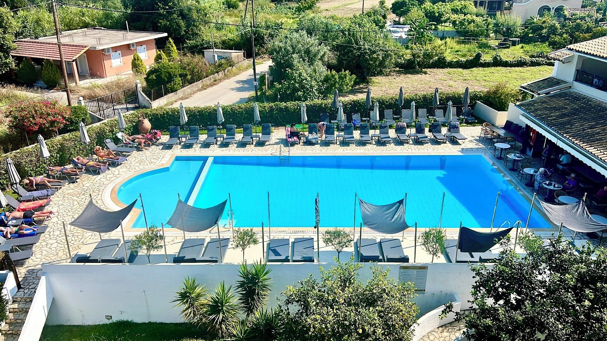 Outdoor pool, open 10:00 AM to 7:00 PM, sun loungers
