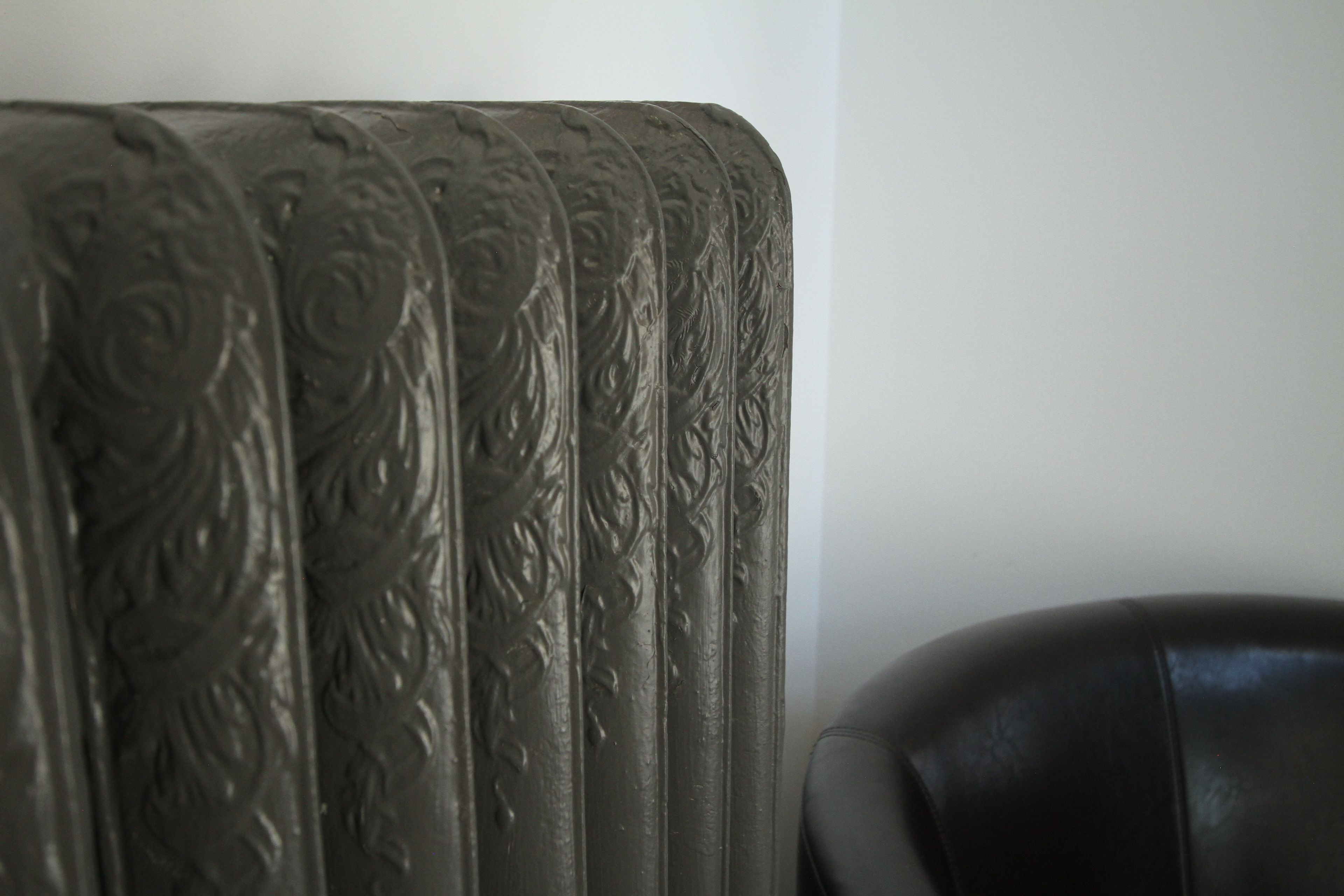 A radiator with intricate floral patterns.