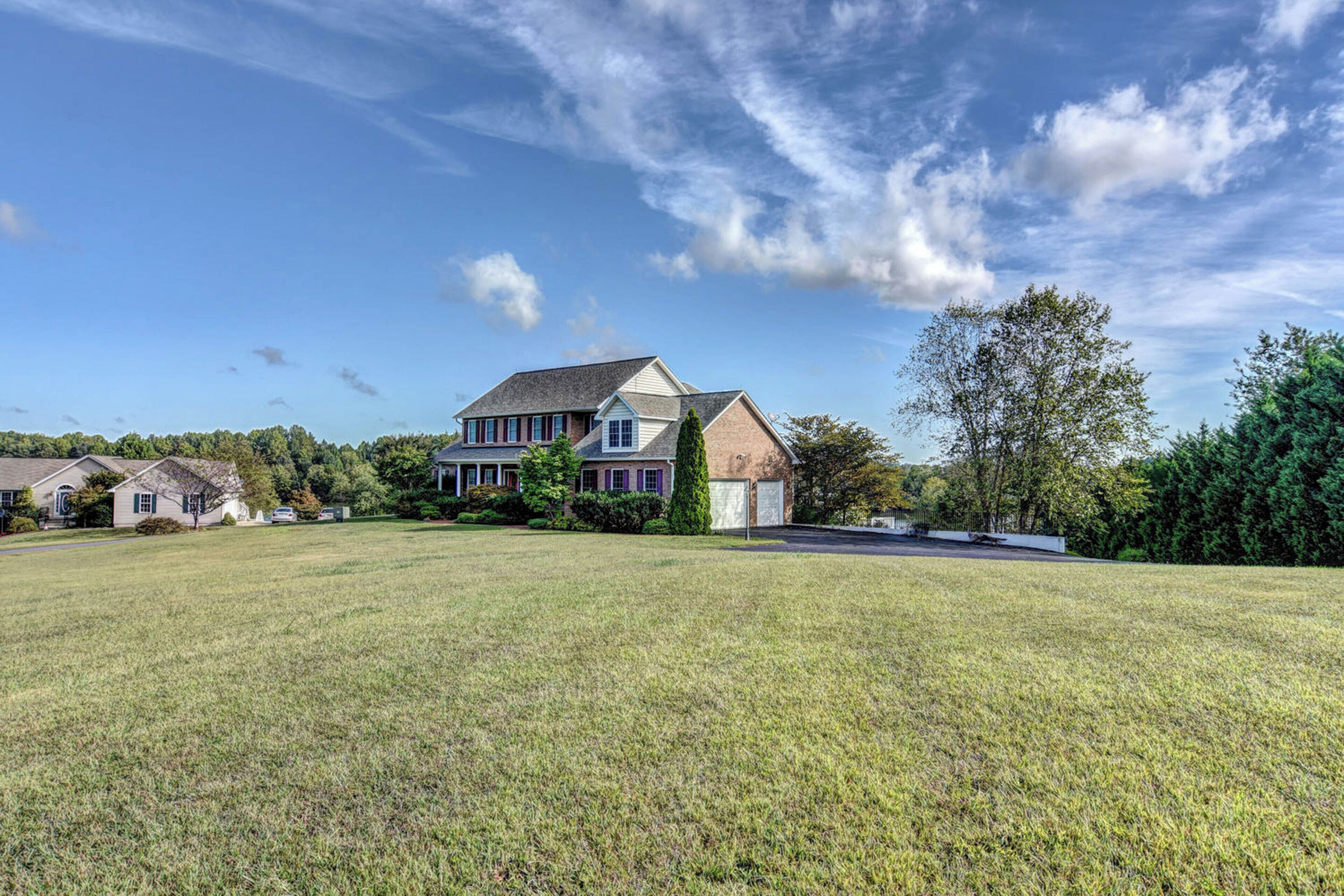 Lakefront home on 2.5 acres with views, firepit and private boat ramp
