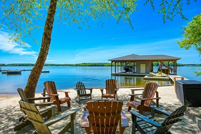 Lakefront home with views, private hot tub, central AC, dock & waterslide