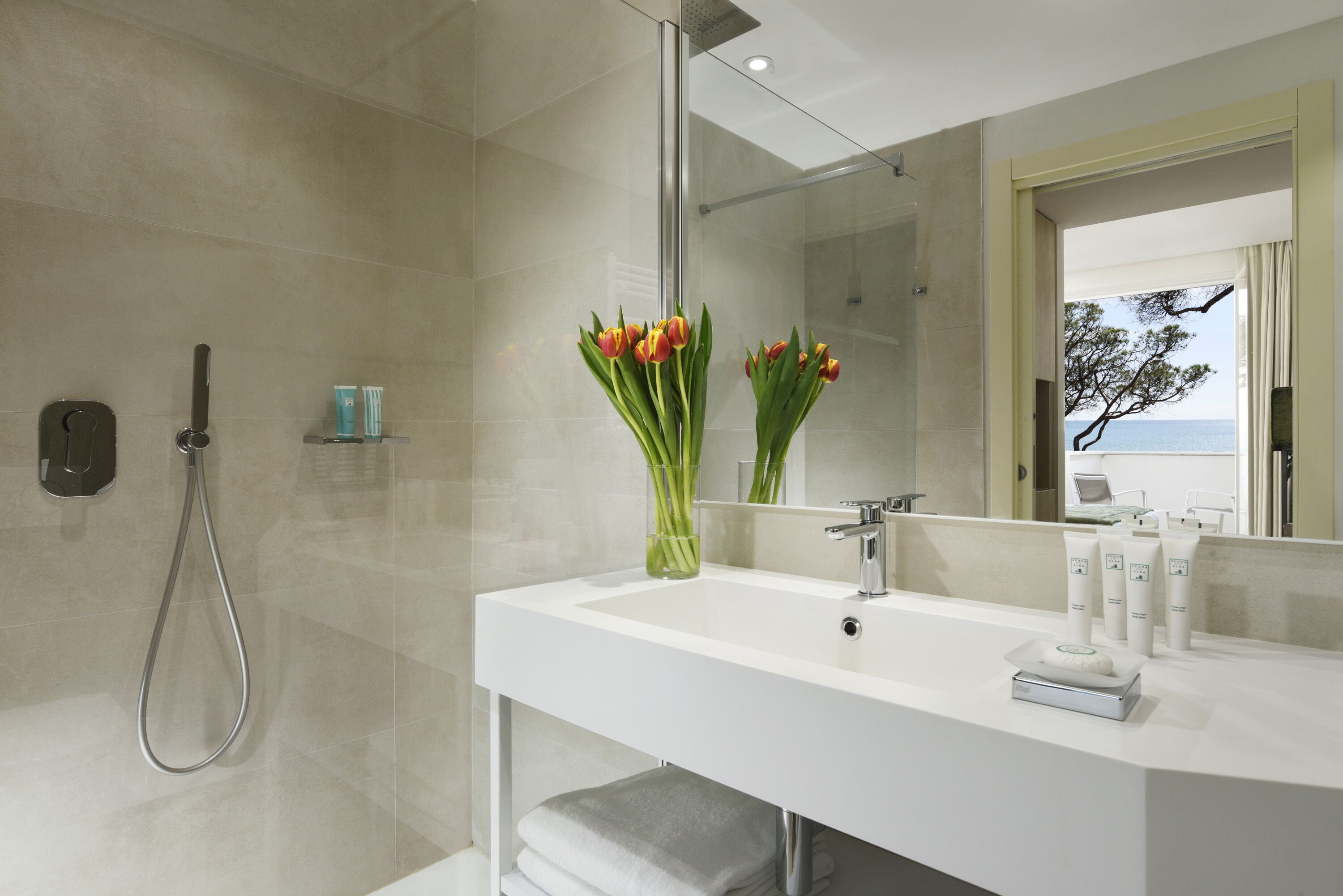 designer toiletries, hair dryer, bidet, towels