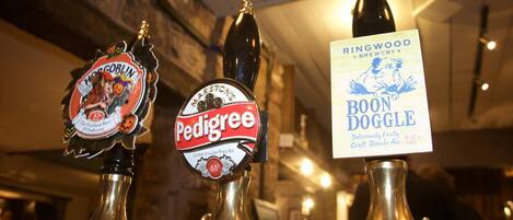Three beer taps labeled Pedigree, Hog Goblin, and Boon Doggle.
