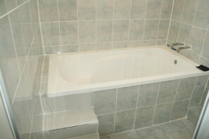 Shower, free toiletries, hair dryer, slippers