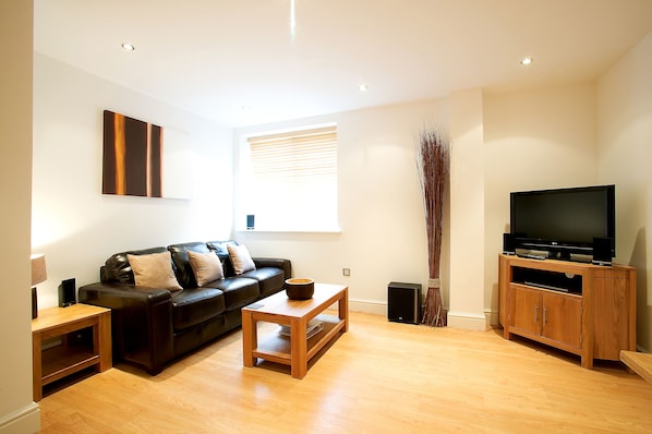 Superior Apartment, 1 Double Bed with Sofa bed | Living area | LED TV, DVD player, heated floors
