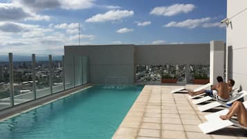 Outdoor pool, open 9:00 AM to 8:00 PM, pool loungers