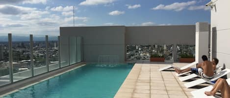 Outdoor pool, open 10:00 AM to 8:00 PM, pool loungers