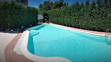 Seasonal outdoor pool, open 9:00 AM to 1:00 PM, sun loungers