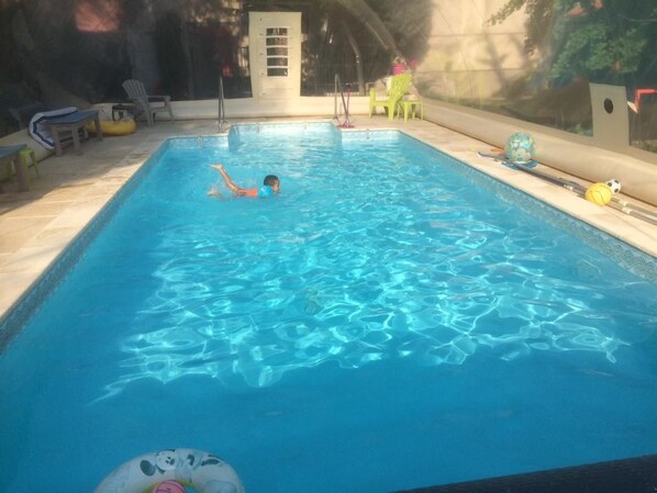 Seasonal outdoor pool, pool umbrellas, pool loungers