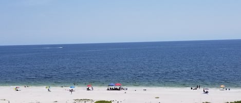 On the beach, sun loungers, beach towels