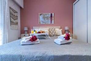 1 bedroom, desk, iron/ironing board, travel crib