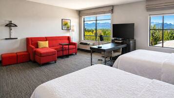 Studio Suite, 2 Queen Beds | Desk, laptop workspace, iron/ironing board, travel crib
