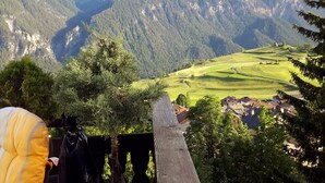 A mountainous landscape with a village in the valley.