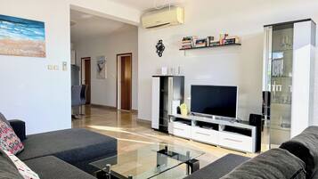 Apartment, 2 Bedrooms, Sea View | Living area | Flat-screen TV
