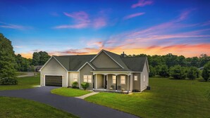 A single-story house with a garage, a covered porch, and a well-maintained lawn. - SUMMER SPECIAL!! Ski, Golf and Fish Haus. 8 Beds, Fireplace, Rivers & Lakes (Thompsonville)