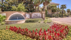 A sign for "Villages Crystal Beach" with a water feature and landscaped garden. - 🏝️ Seaside Therapy| 6BR | Near Resort Pool and Beach! (Destin)