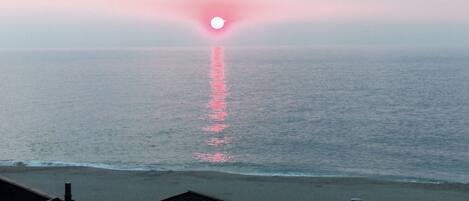 On the beach, sun-loungers