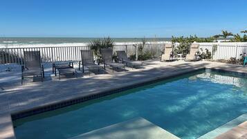A heated pool, pool umbrellas