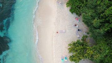 On the beach, white sand, beach shuttle, sun loungers