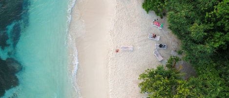 On the beach, white sand, beach shuttle, sun loungers