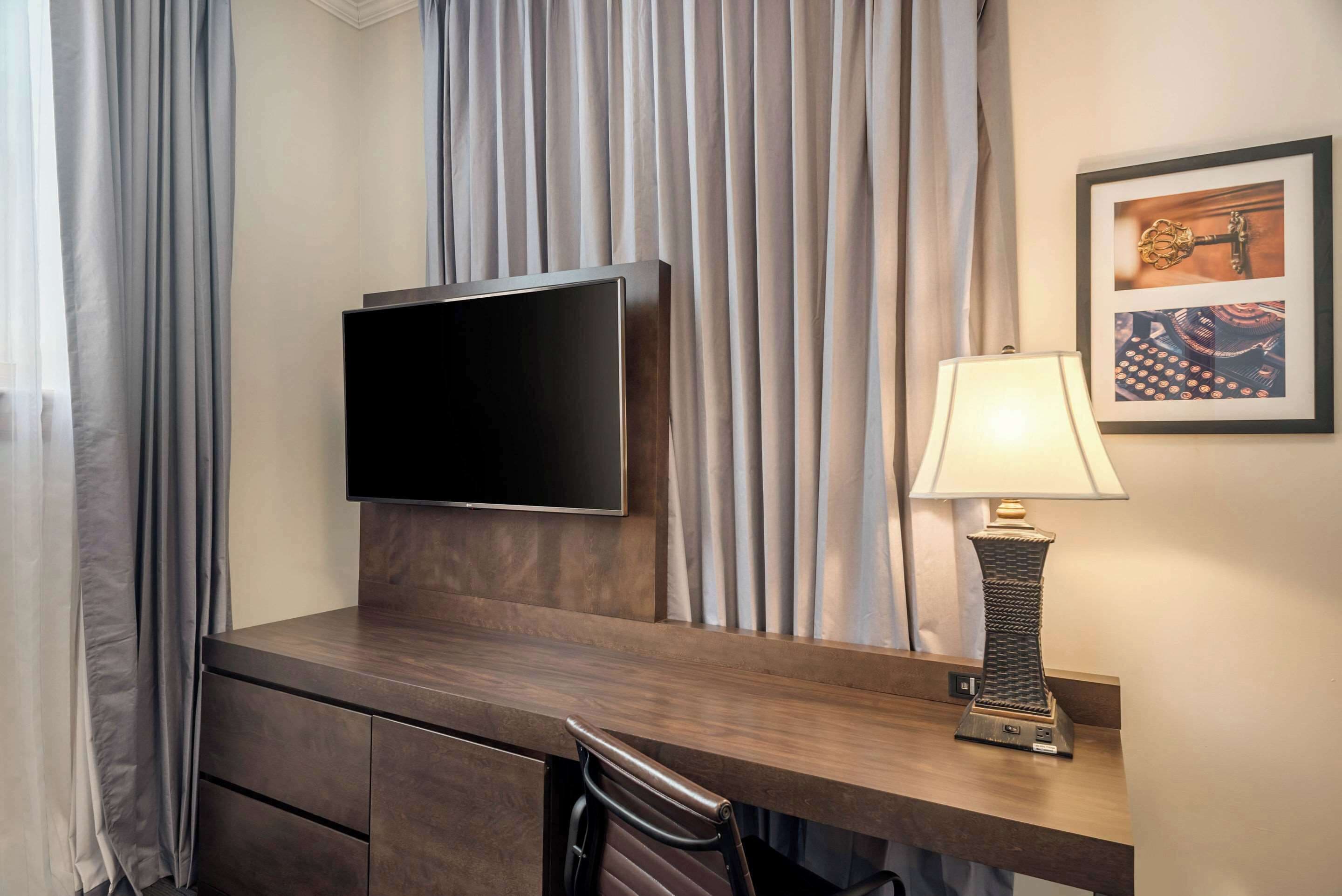 room, 1 queen bed, non smoking | desk, blackout curtains, iron/ironing board, cots/infant beds