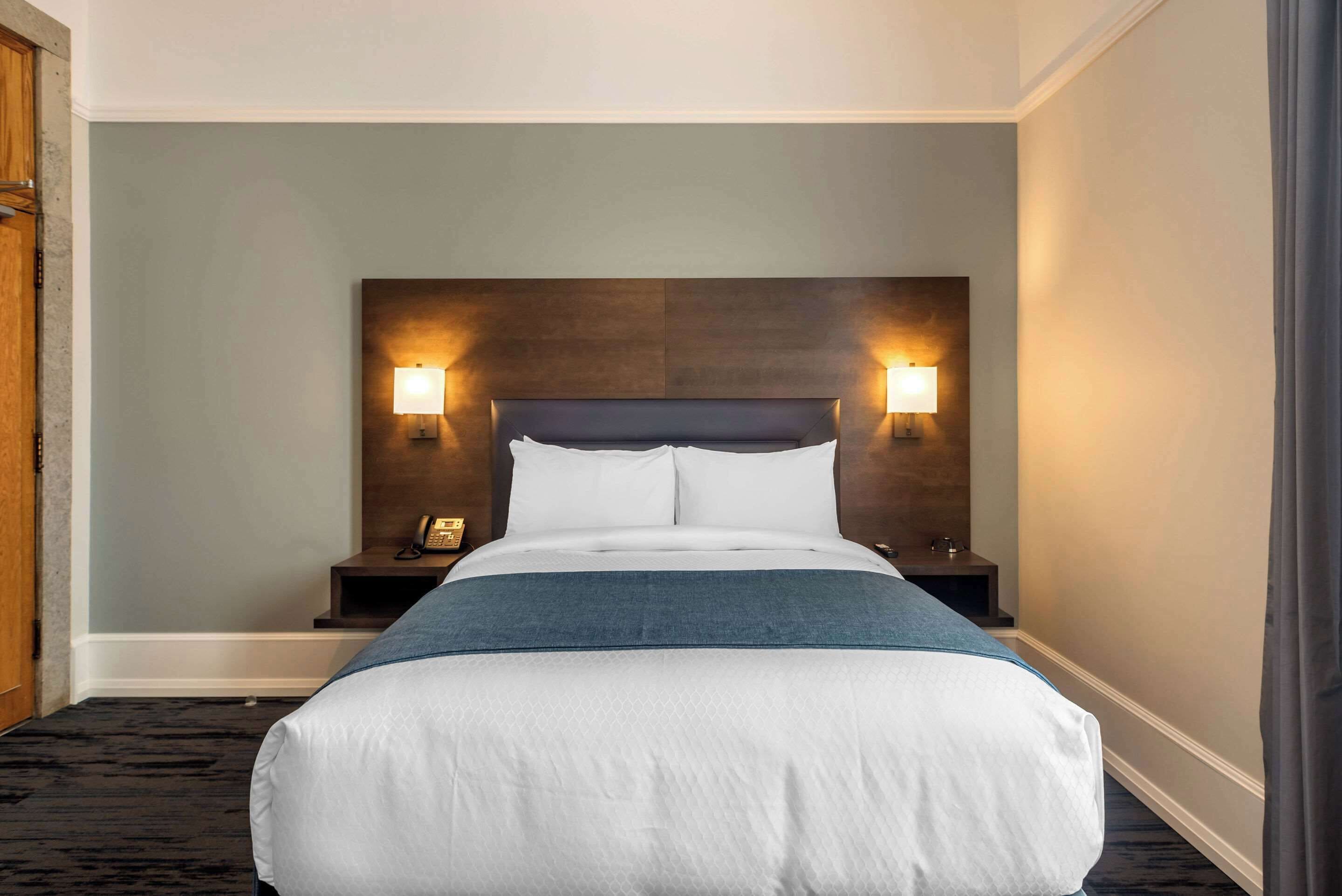 desk, blackout curtains, iron/ironing board, cots/infant beds