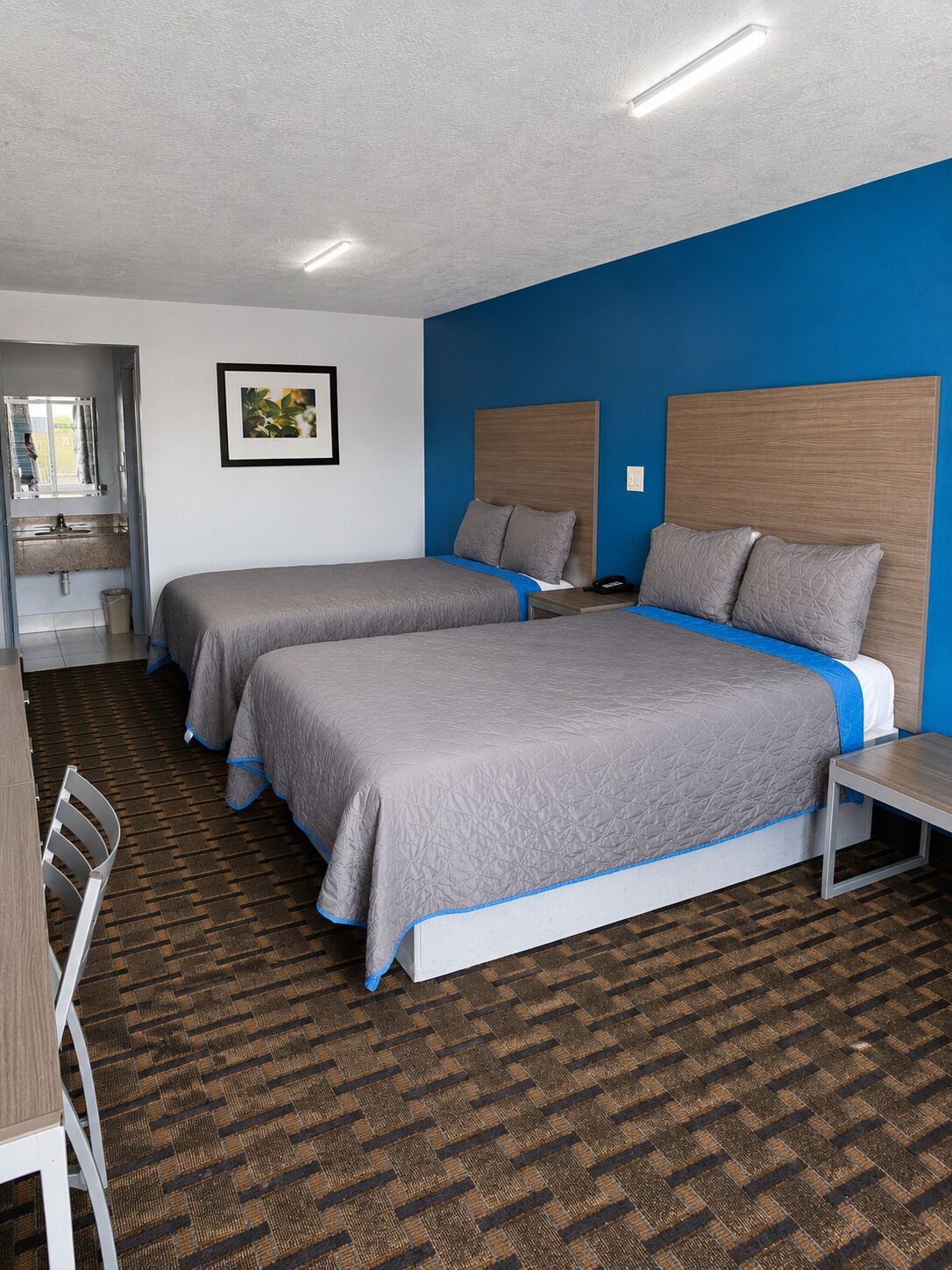 Economy Double Room, 2 Double Beds, Non Smoking | Individually decorated, individually furnished, desk, soundproofing